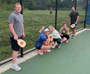Mahoney employees playing pickle ball.