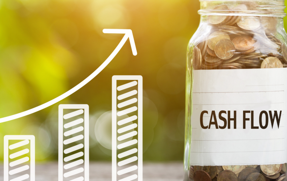 Chart of cash flow increasing with a jar of coins labeled "cash flow"