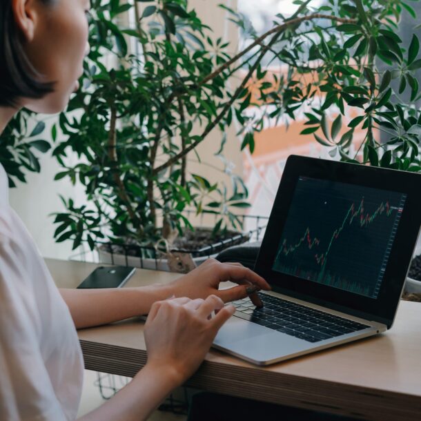 Businesswoman in a white shirt using her laptop.