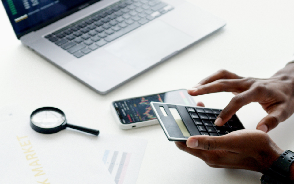 Aerial Photo Of Person Using Calculator