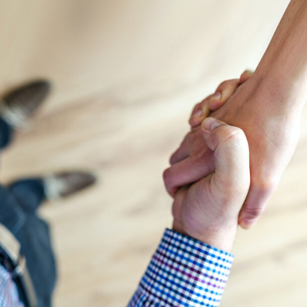 Two people shaking hands.
